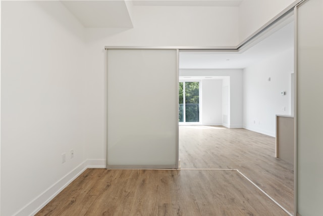 White wooden door near brown wooden parquet floor